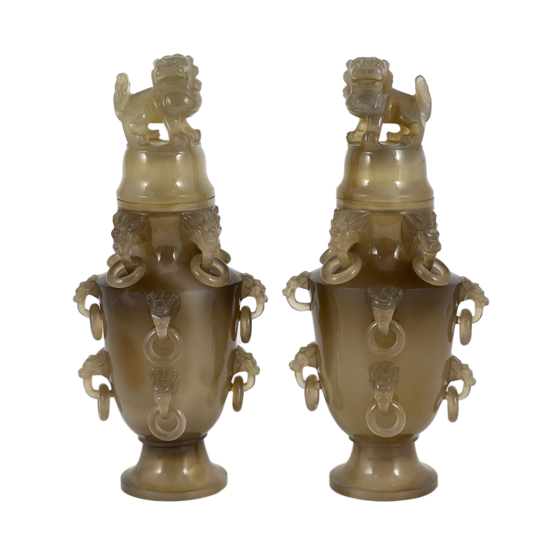 A pair of Chinese agate vases and covers, early 20th century, 19.5cm high, chip to one lion